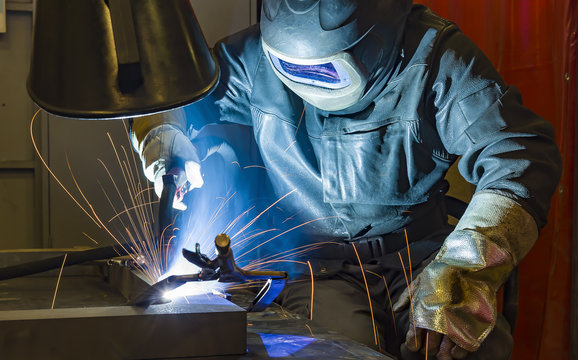 Industrial steel welder in factory