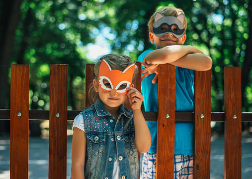 Children with animal masks playing outside