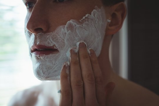 Man applying shaving foam