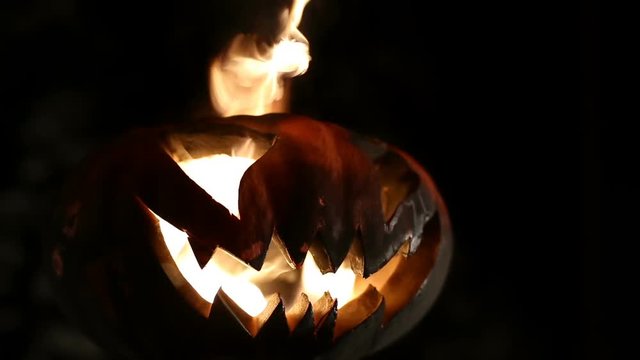 Burning pumpkin on Halloween. Looped