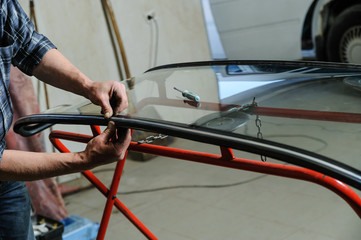 Repair and replacement of the windshield of the car.