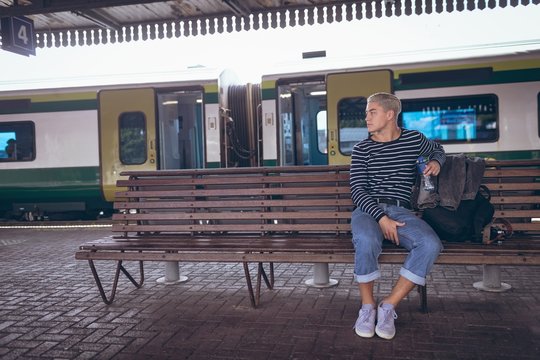 Thoughtful man sitting on bench