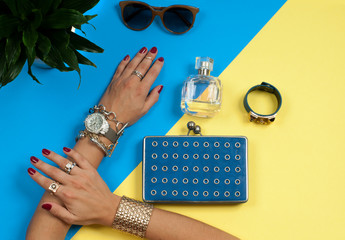  Female hands with jewelry. Fashion accessories, wrist watches, glamor bracelets
