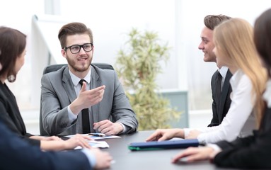 businessman at a meeting with employees