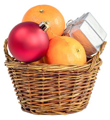 Christmas gift basket with a festive glass ball ornaments red fruit and Mandarin orange, a box of surprise isolated on white background