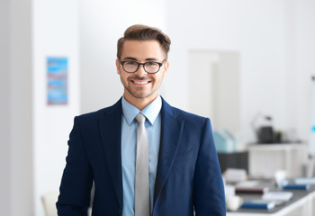 Young handsome man in office © Africa Studio