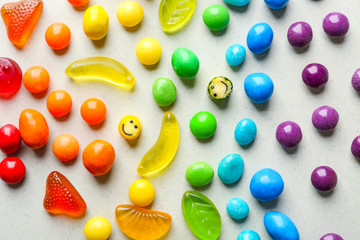 Colorful candies on light background