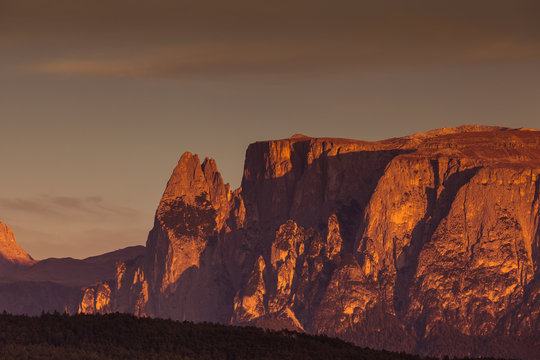 Last autumnal sunset light on Sciliar summit, Dolomites, Alto Adige/South Tyrol, Italy