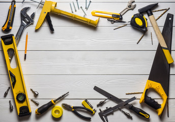 The layout of tools on white wooden