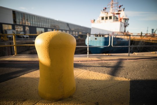 Marine mooring bollard at harbor