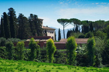 Fototapeta na wymiar ROME, ITALY - October 7, 2017: Antique rural building in resort on famous ancient Appia road. Panoramic view of Rome countryside, with green grass, trees and hills in the background