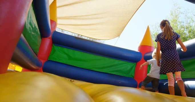 Kids playing on the bouncing castle 