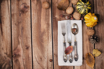 Autumn decor of a table, served with cutlery