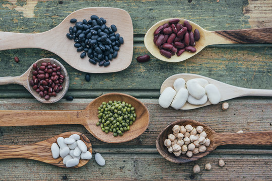 Food: Different Beans on wooden Spoon