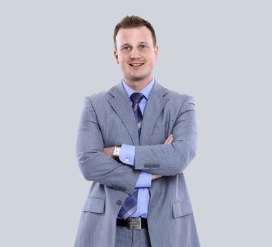 Young manager smiling isolated on gray background