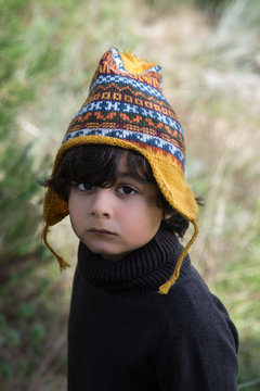 Latin boy with a perunian hat