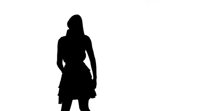 Girl sings in a retro microphone. Silhouette. White background