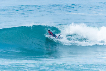 Bodyboarder surfing ocean wave