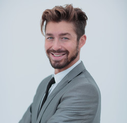 Close up portrait of a smiling handsome business man  over white