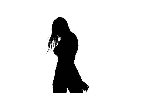 Girl is sexually wriggling her body. Silhouette. White background. Slow motion