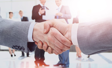businessman shaking hands to seal a deal with his partner
