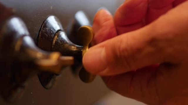 The Elderly Man Hand Turning On Gas Stove