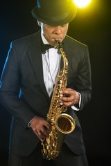 Fototapeta na wymiar Man playing Jazz on the Saxophone