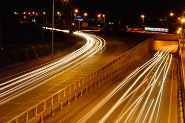 Fototapeta na wymiar Cars speeding on a highway