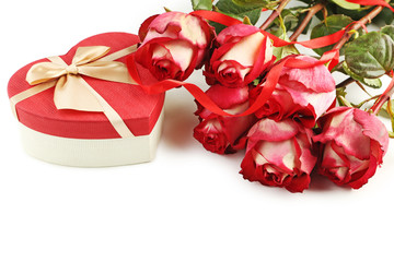 Beautiful red roses with gift box on white background
