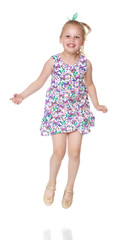 Little girl is jumping.