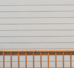 Deck Railing in Front of Cream Siding
