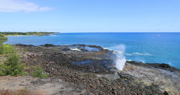 Kauai Hawaii Spouting Horn blowhole ocean. Big Island economy is tourism based. Water and tropical beach recreation and fun. Beautiful clear blue ocean sea.
