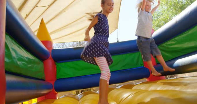 Kids Playing On The Bouncing Castle 