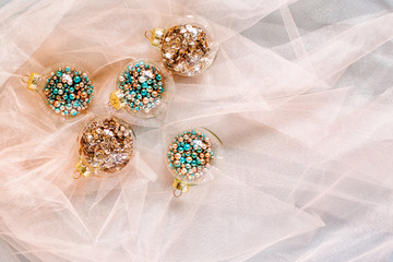 Christmas glass transparent ball with colorful sparkle confetti and decoration. Christmas concept