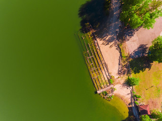 Aerial view, An old destroyed barge that sank sunken by river bank