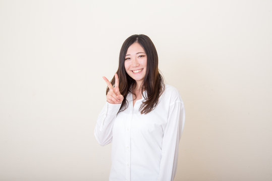 Young Asian Woman With Peace Sign