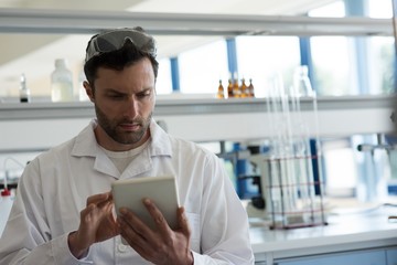 University student using digital tablet in laboratory