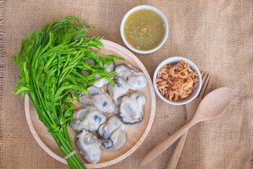 Thai local food fresh oyster with seafood spicy sauce