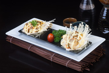 japanese cuisine. grilled shell fish on the background