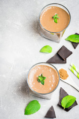 Healthy chocolate mint milkshake. Top view, copy space.