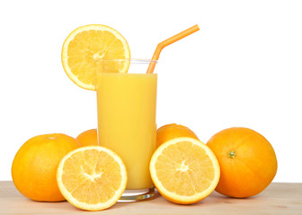 Glass of orange juice on a wood table surrounded by fruit. Orange straw, slice of citrus fruit on side of cup, isolated on white background.