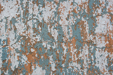 Multicolored peeling wall texture and background. Surface with scratches, stains.