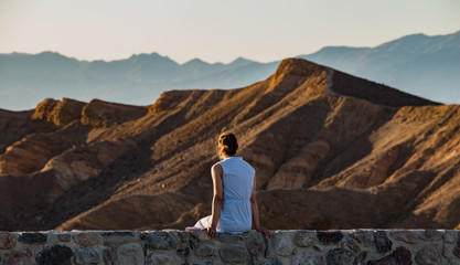 Fototapeta na wymiar Woman enjoying desert sunset in Death Valley