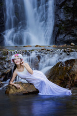 Beautiful girl with waterfall