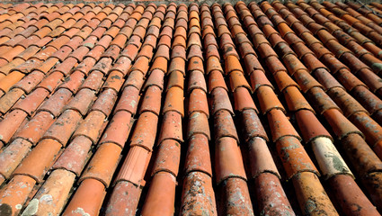 The view from the top of the old red-orange-brown tiles. The roof of the old house.