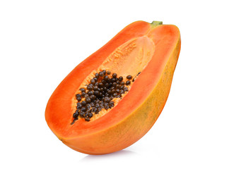 half of ripe papaya fruit with seeds isolated on white background