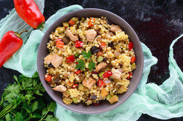 Warm dietary salad from baked vegetables (zucchini, sweet pepper, eggplant, onion), chicken and...