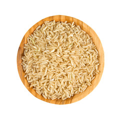 brown rice in a olive wood bowl isolated on white