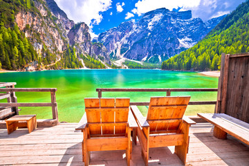 Relax deck chair by Braies lake in Alps