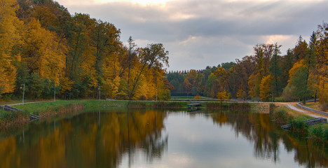 Fototapeta na wymiar Beautiful autumn landscape with fog over lake